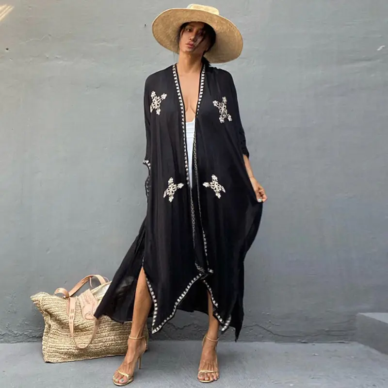black rayon embroidered holiday sun protection cardigan featuring white cross-like patterns and beaded trim