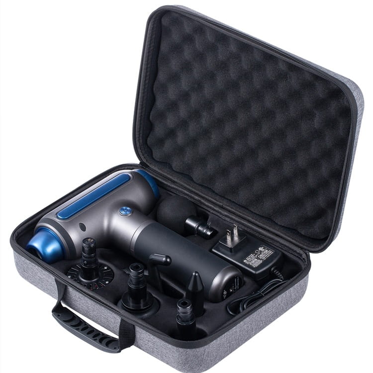 Gray and blue handheld muscle relaxation massager with hot compress feature and interchangeable attachments nestled in a protective carrying case