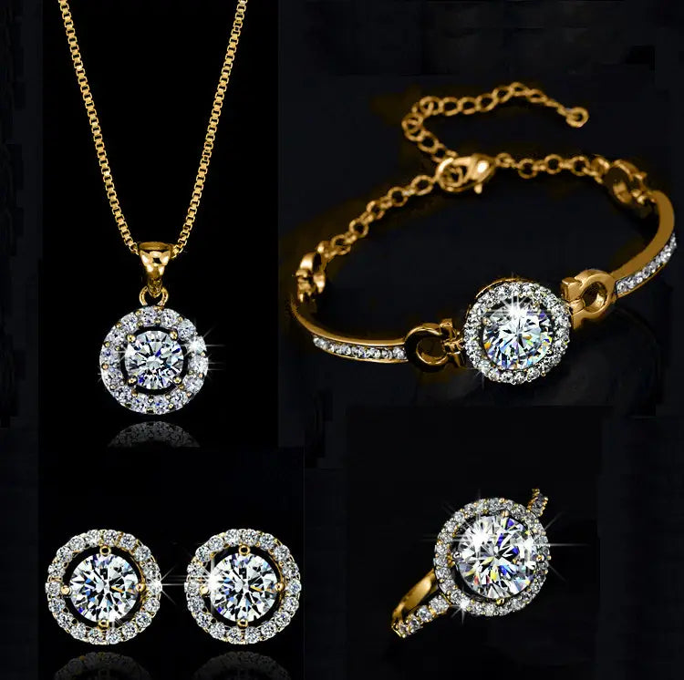 Gold-toned jewelry sets featuring a central round-cut clear gemstone surrounded by smaller sparkling stones with matching necklace, bracelet, earrings, and ring for luxury women’s fashion.