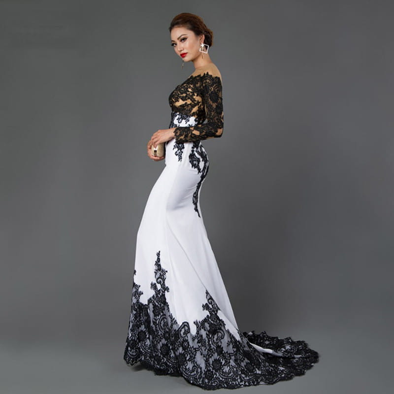 Elegant black and white fishtail slim tail gown featuring intricate embroidered lace maxi detailing along the bodice, sleeves, waistline, and hem.