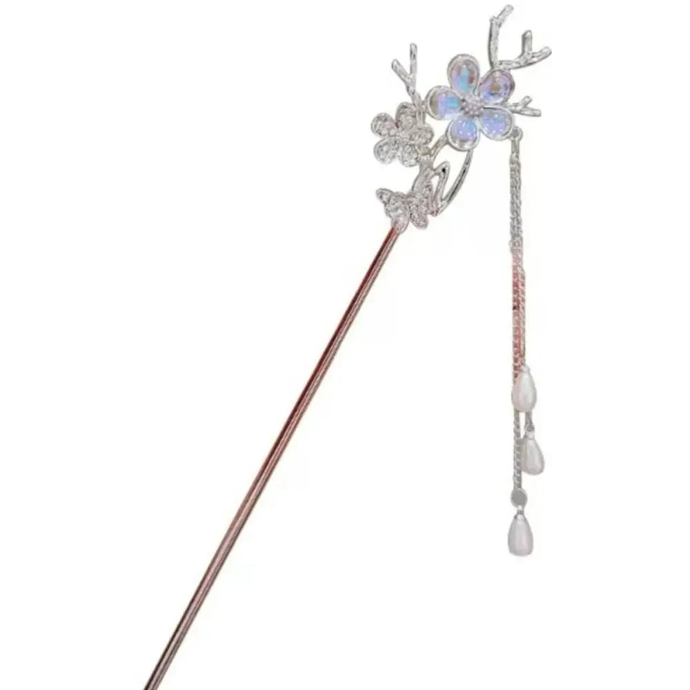 A delicate silver celestial moonstone xingx hairpin with sparkling floral design and dangling teardrop beads for updo moonstone style