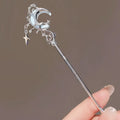 Silver celestial moonstone xingx hairpin with crescent moon charm and delicate stars on a slender metallic stem for updo moonstone styles