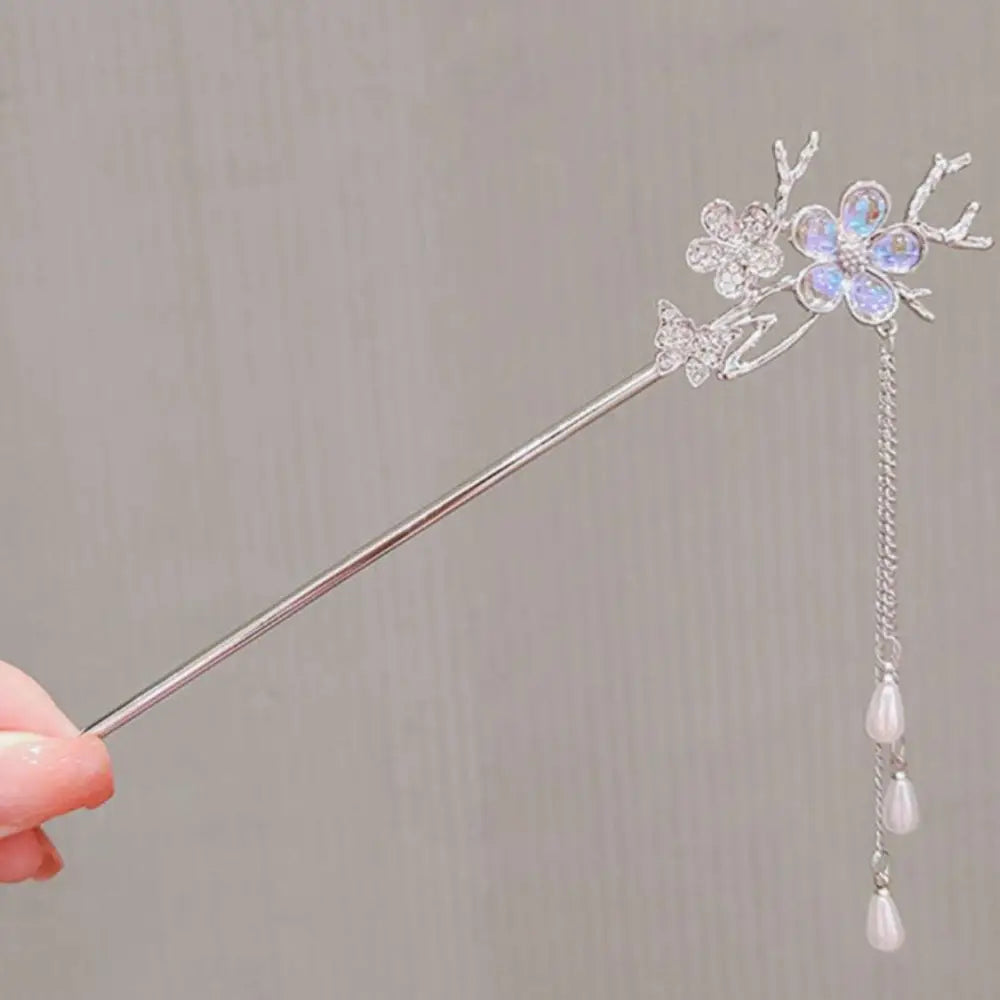 Two silver-toned hairpins with celestial moonstone xingx crescent moon and star filigree designs for elegant updo moonstone styling