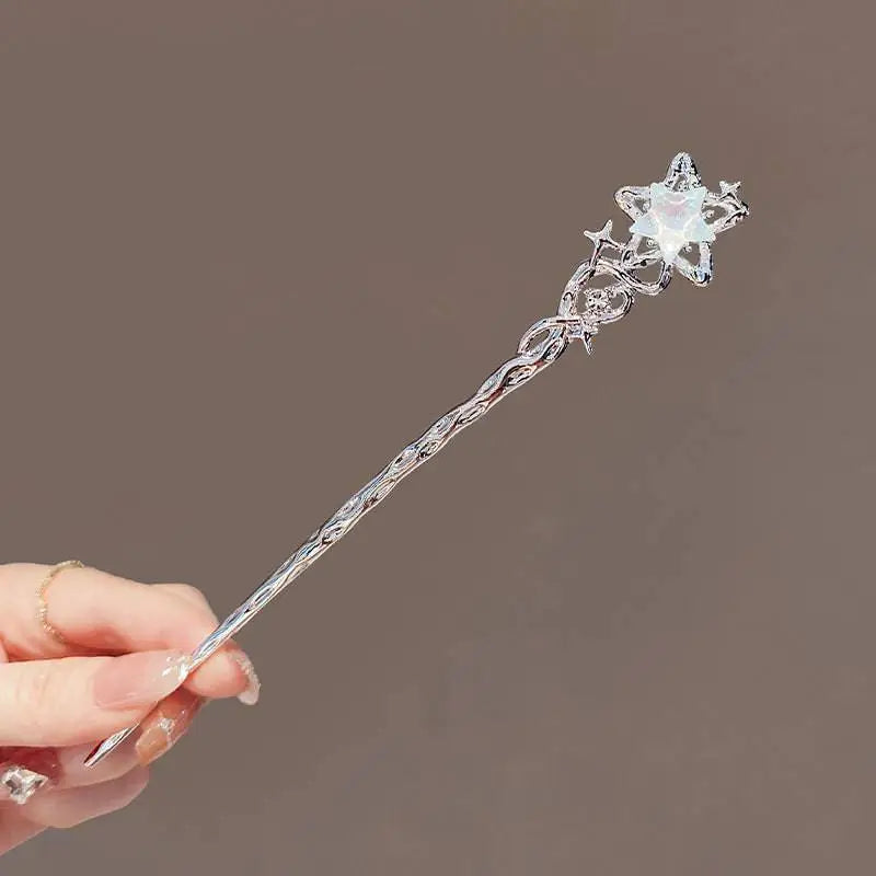 A delicate silver star-shaped celestial moonstone xingx hairpin with iridescent gemstone for elegant updo moonstone styles