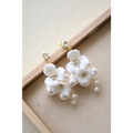 Delicate white ceramic flower pearl embellished bridal hairpin with handcrafted petals and gold toned studs