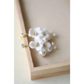 Delicate white ceramic flower pearl embellished bridal hairpin with gold-tone hardware and pearl accents