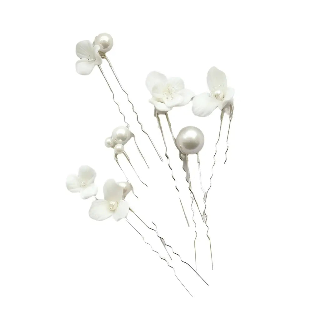 Delicate white ceramic flower pearl embellished bridal hairpin with silver-toned twisted metal stems