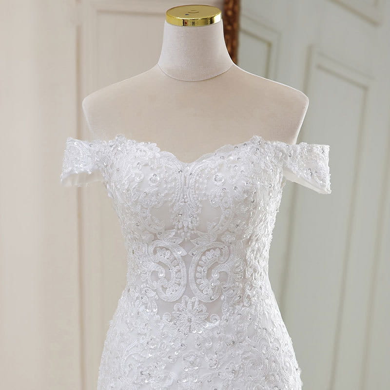 High waist white lace mermaid wedding dress featuring an off-the-shoulder design with intricate floral embroidery and sparkling beading made from polyvinyl alcohol fiber.