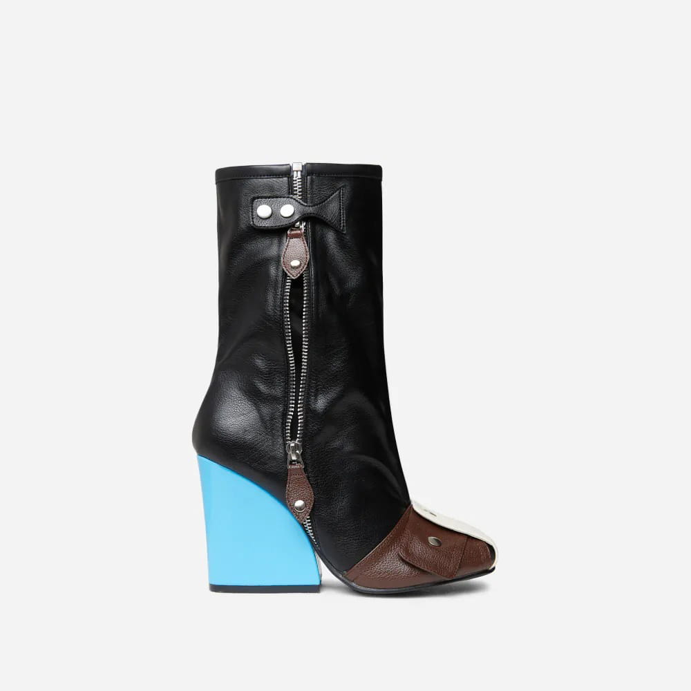 black leather high heel short tube boots with a bold turquoise block heel brown toe cap and side zipper closure