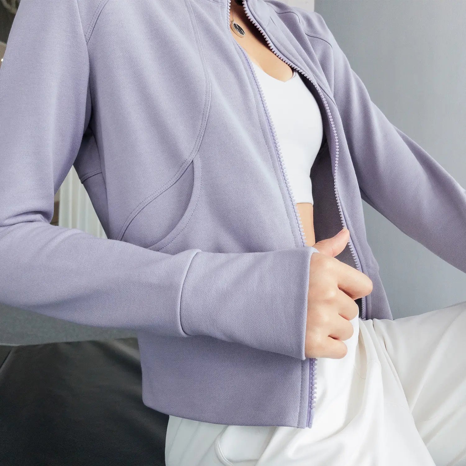 Olive green cropped running sport coat with ribbed texture and subtle seam detailing designed for winter running sport in royale essence lux material.