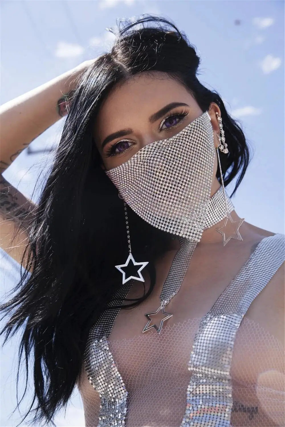 Silver rhinestone metal flash mesh face mask paired with star-shaped dangling metal flash jewelry earrings.