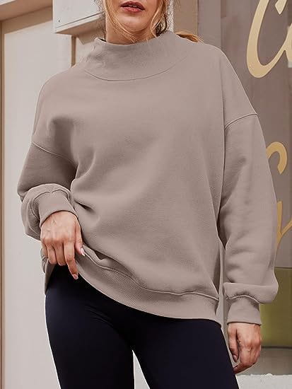 A cozy oversized taupe pullover sweatshirt solid featuring a high turtleneck and ribbed cuffs in a solid color design.