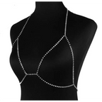 Silver rhinestone body chain harness paired with a champagne satin blouse featuring rhinestone body jewelry accents