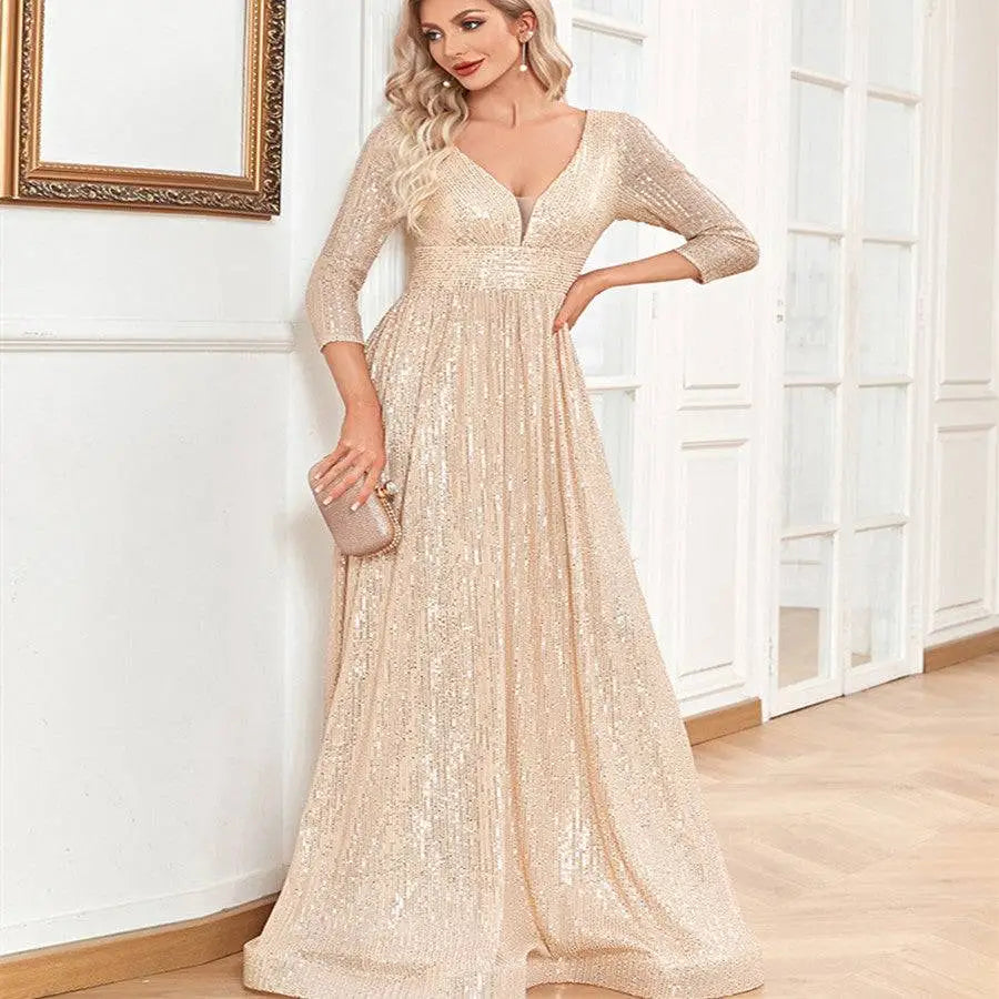 Champagne sequined evening gown with deep v-neckline and three-quarter sleeves for formal party wear