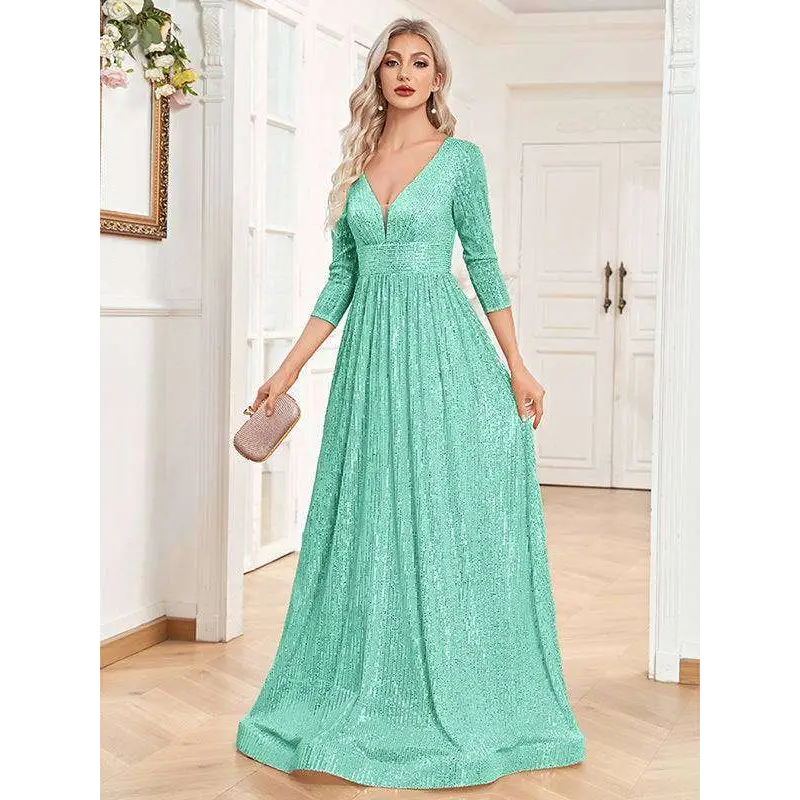 A shimmering mint green sequined evening gown with a deep v-neckline and three-quarter sleeves for formal events