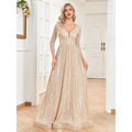 A champagne sequined evening gown with a deep v-neckline three-quarter sleeves and a fitted waist flowing skirt
