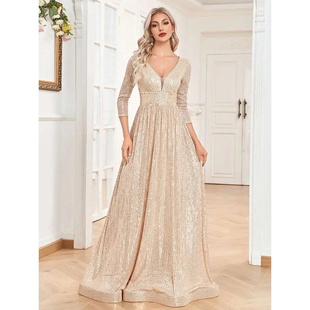 A champagne sequined evening gown with a deep v-neckline three-quarter sleeves and a fitted waist flowing skirt