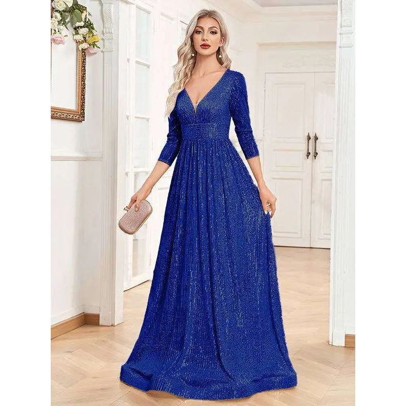A shimmering royal blue sequined evening gown with deep v-neckline and three-quarter sleeves for formal events