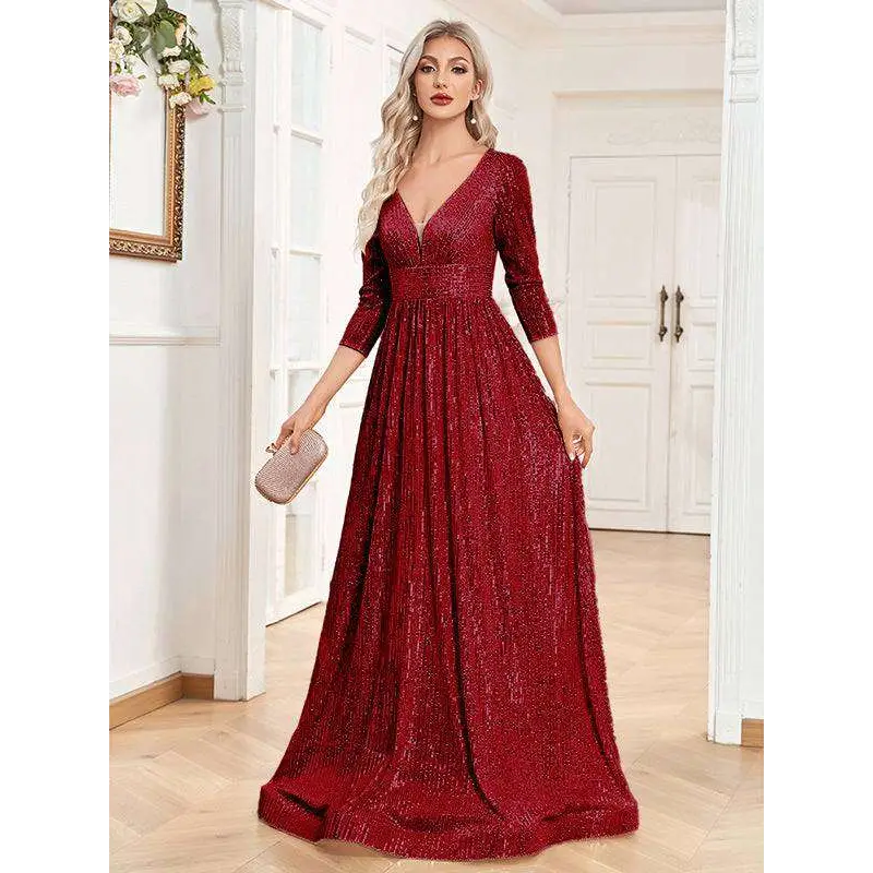 A shimmering red sequined evening gown with a deep v-neckline and three-quarter sleeves for formal events