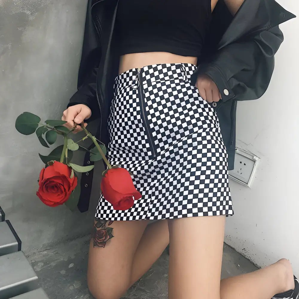 Black and white checkered mini skirt with front zipper closure featuring variable mso-font-signature design