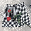 Black and white checkered mini skirt with front zipper closure featuring variable mso-font-signature design