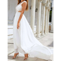 White lace chiffon lace trailing wedding large swing dress with crop top and flowing chiffon skirt and high-heeled sandals