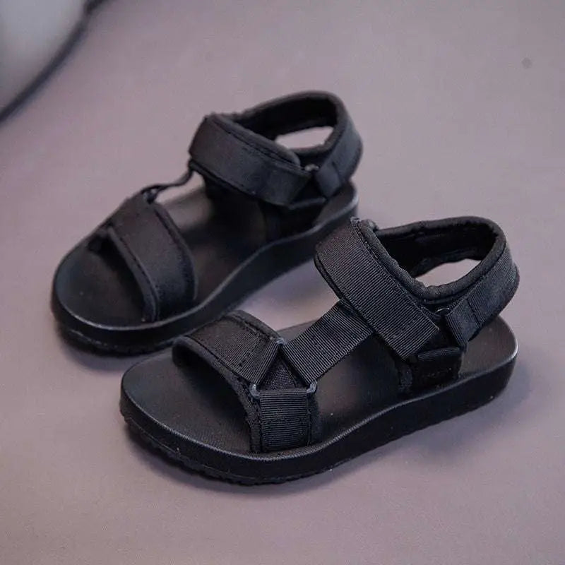 Black childrens peach breathable casual shoes with adjustable velcro straps and durable rubber sole for school use