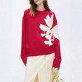 Red knit christmas 3d floral contrast color crewneck sweater with large cream-colored knit floral design on front