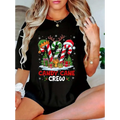 Black cotton christmas candy print t-shirt featuring festive candy cane crew graphic with hats presents and antlers