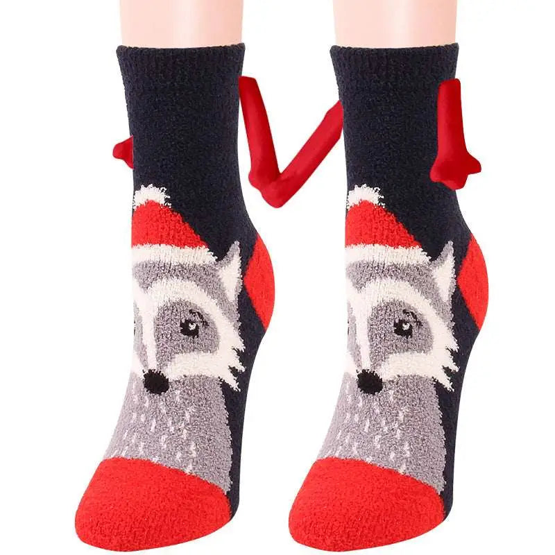 Black and red fuzzy warm slipper socks with a gray raccoon in a santa hat and red antler tabs magnetic suction couple