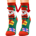 Fluffy green and red christmas magnetic suction couple socks with smiling santa, gift boxes, and soft plush material