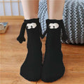 Black knit warm slipper socks with playful cartoon dog faces and floppy ears from christmas supplies magnetic suction couple