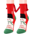 Red and green christmas-themed warm slipper socks with snowman design and merry christmas lettering magnetic suction couple socks
