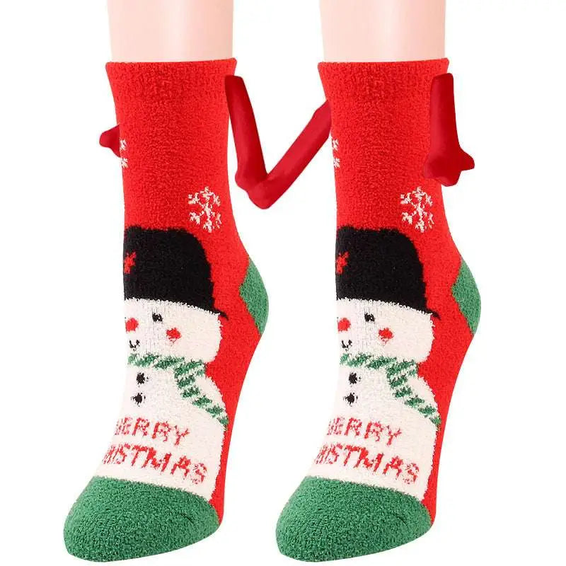 Red and green christmas-themed warm slipper socks with snowman design and merry christmas lettering magnetic suction couple socks