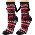 Black knit warm slipper socks with red and white festive reindeer patterns and magnetic suction couple feature