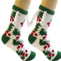 White and green christmas-themed magnetic suction couple fuzzy socks with red berry accents and plush material