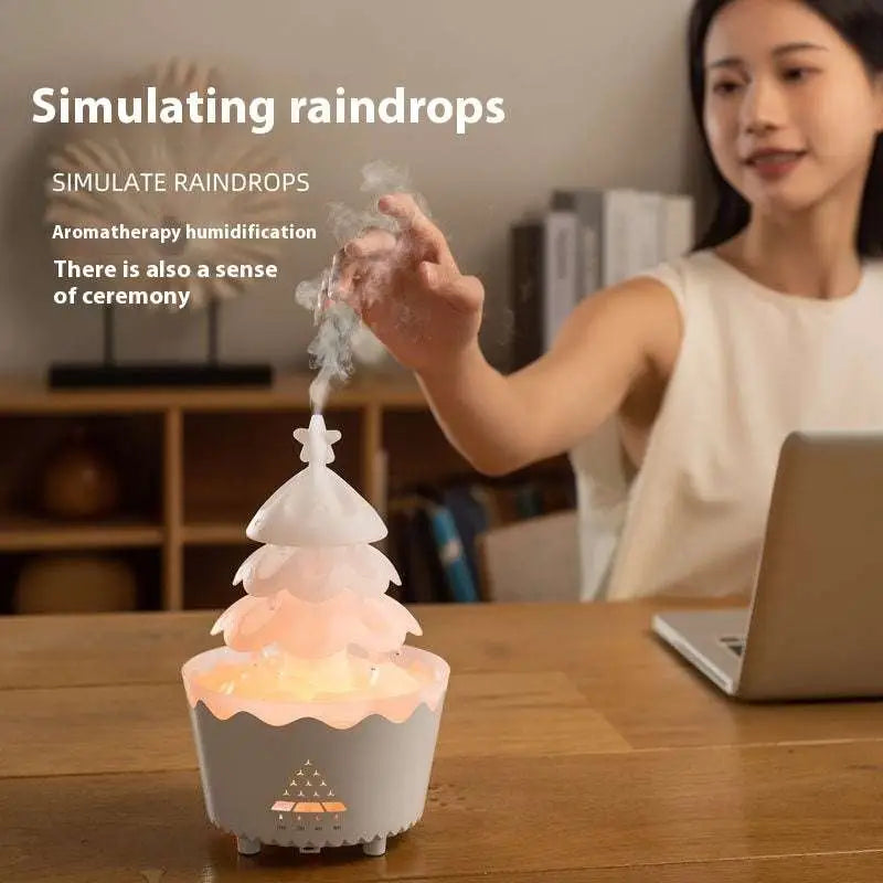 White christmas tree essential oil aroma diffuser humidifier with tiered layers and soft glowing lights