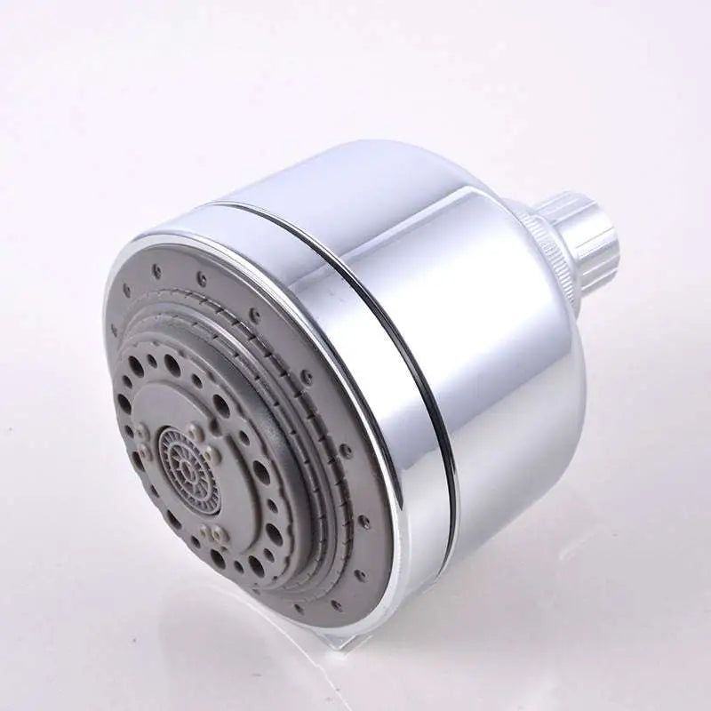 Chrome plastic small shower head with sleek cylindrical design, chrome finish, gray multi-hole spray face, and textured knob