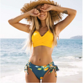 Yellow bikini swimsuit with citrus print yellow design and side ties in a bright yellow two-piece style