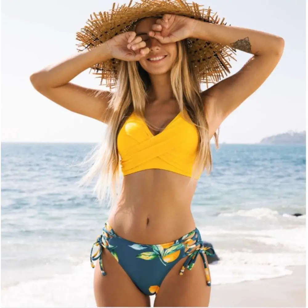 Yellow bikini swimsuit with citrus print yellow design and side ties in a bright yellow two-piece style