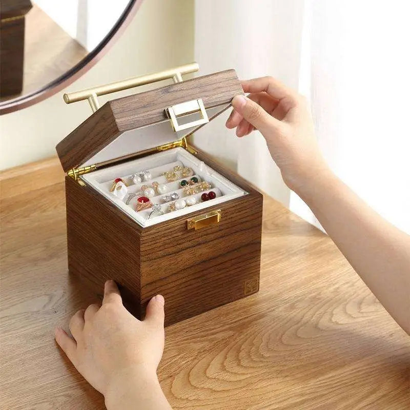 Classical wooden jewelry box with mirror gold-tone handle and white velvet lined compartments for earrings