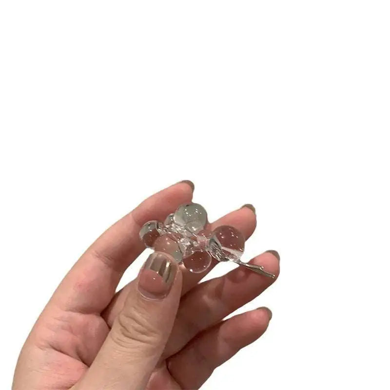Clear acrylic beaded clip earrings with translucent glass beads and silver metal clasp in a delicate cluster design