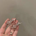 Clear acrylic beaded clip earrings with faceted glass beads and silver metal clasp posts for elegant wear