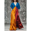 A flowing color block satin maxi dress with round neck loose fit and loose short sleeves in bold blue orange and red hues