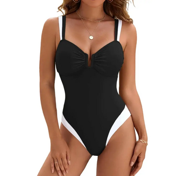 Black and white color block tummy control one-piece swimsuit with thin straps, ruched bust, and high cut legs