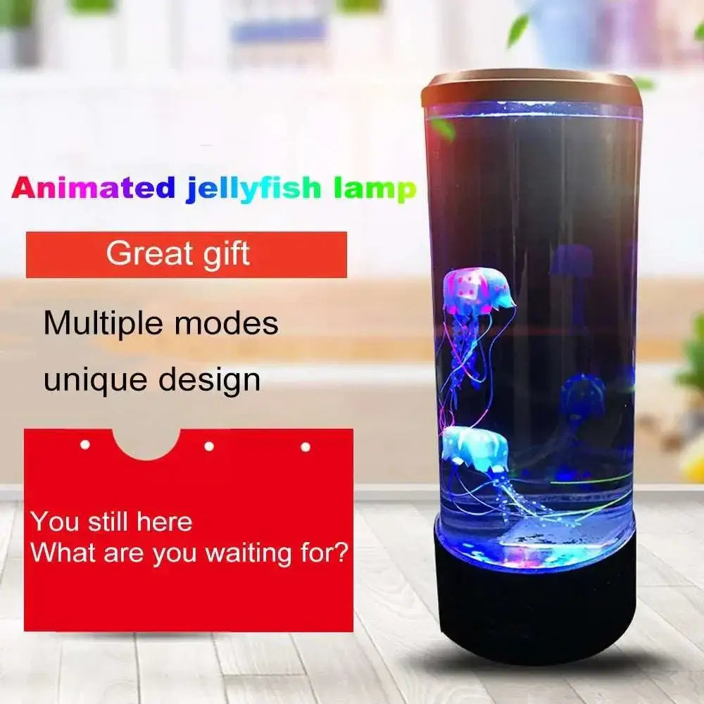 A color changing led jellyfish lamp with a cylindrical glass design, gold top, black base, and glowing blue and purple jellyfish