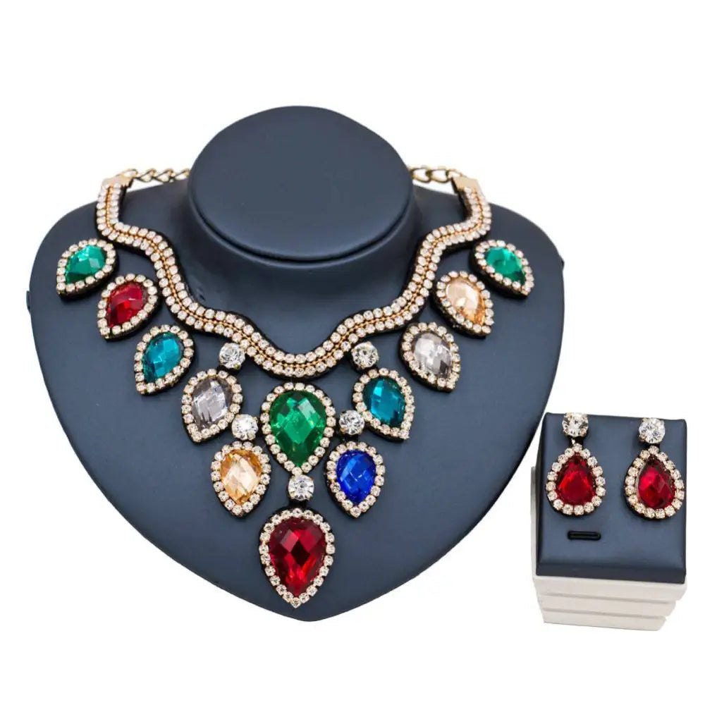Colorful exaggerated bride necklace and earring set with teardrop red green blue amber gemstones on gold-tone chain