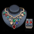 A dazzling gold-tone colorful exaggerated bride necklace and earring set with red green blue and clear teardrop rhinestones