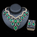 Emerald green teardrop pendant colorful exaggerated bride necklace and earring set in silver-tone with crystal accents displayed on black bust