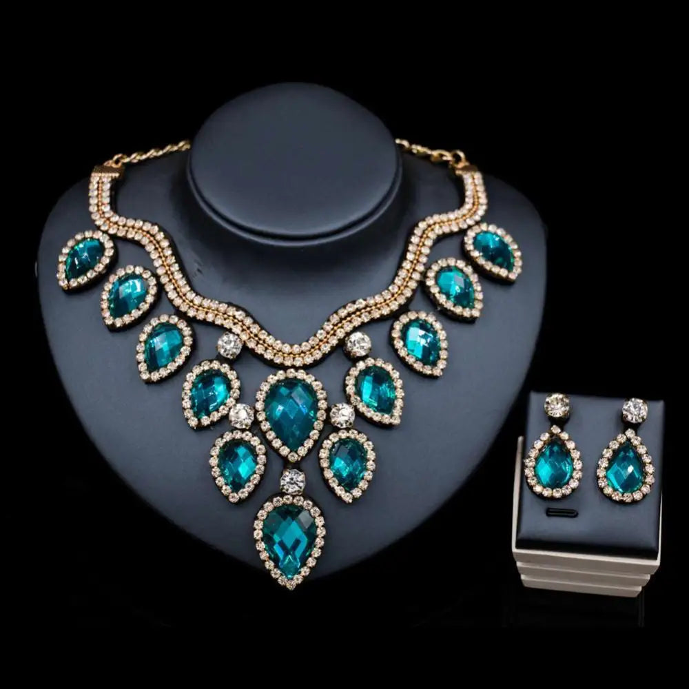 Teal and gold colorful exaggerated bride necklace and earring set with teardrop crystals and diamond accents
